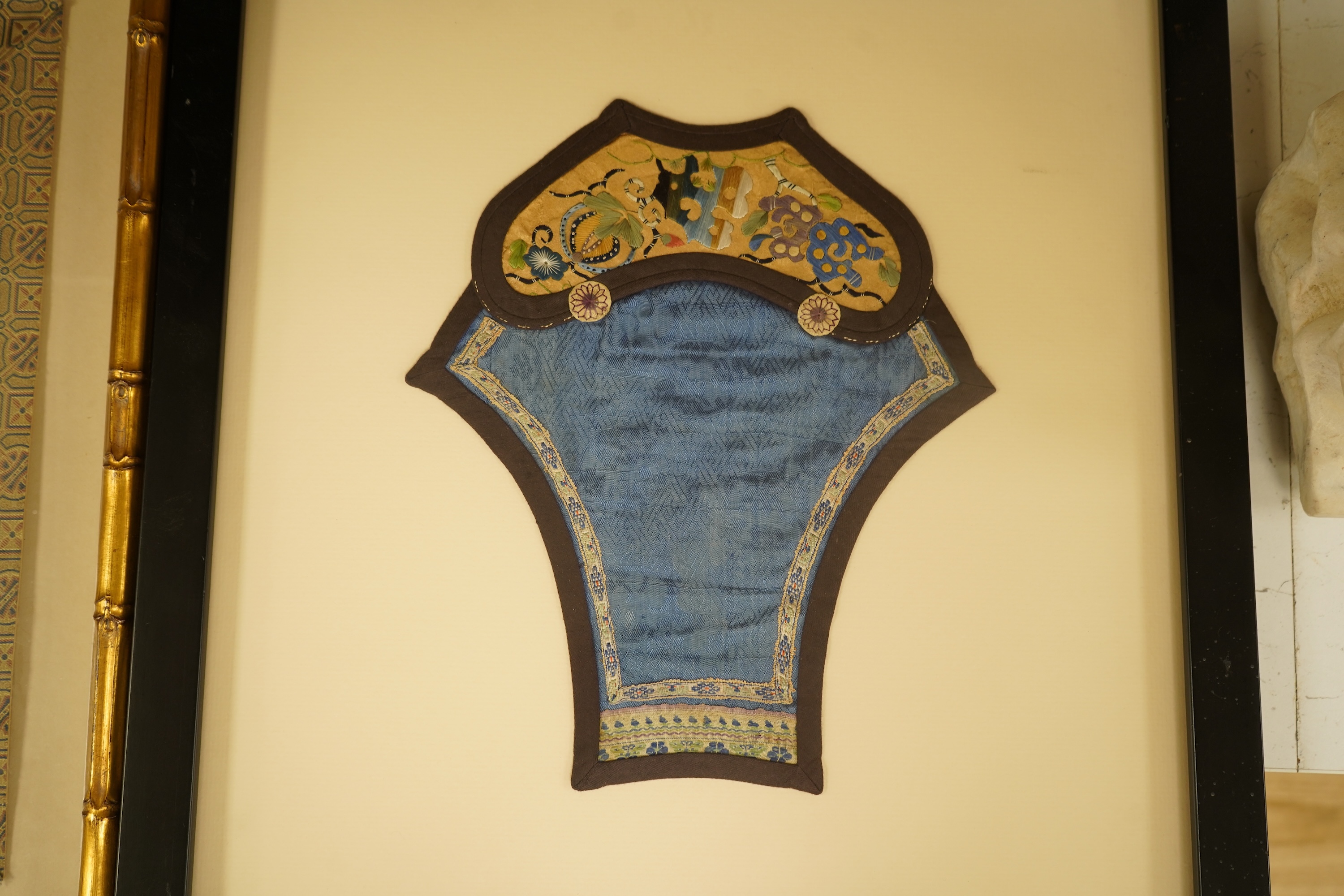 Two Chinese silk panels with polychrome embroidery, one housed in a faux bamboo frame, largest 47cm high
